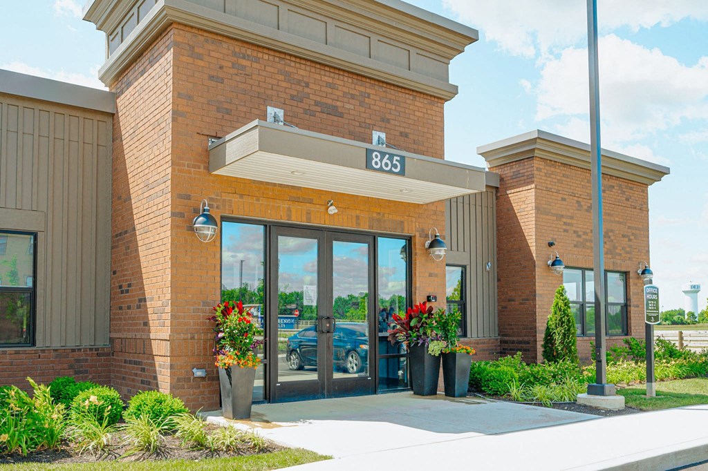 the front of a building with glass doors