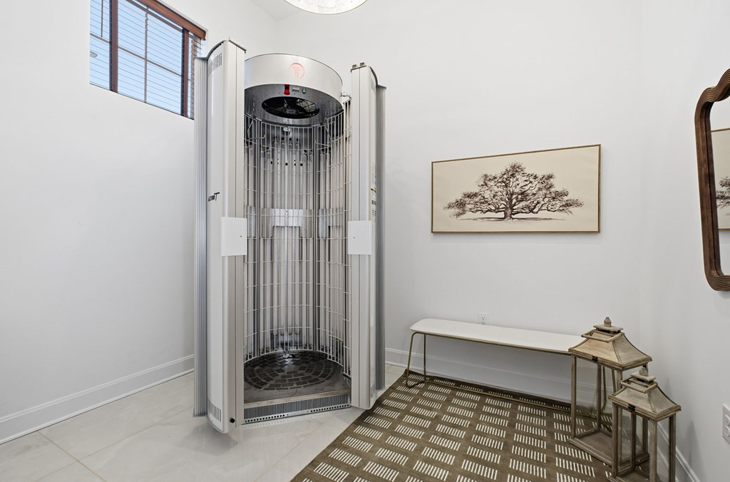 A room with a large oven and a bench.