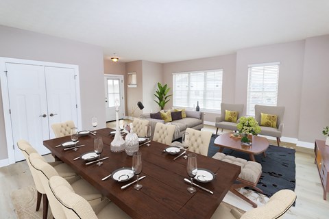 A dining room with a large table set for a meal.
