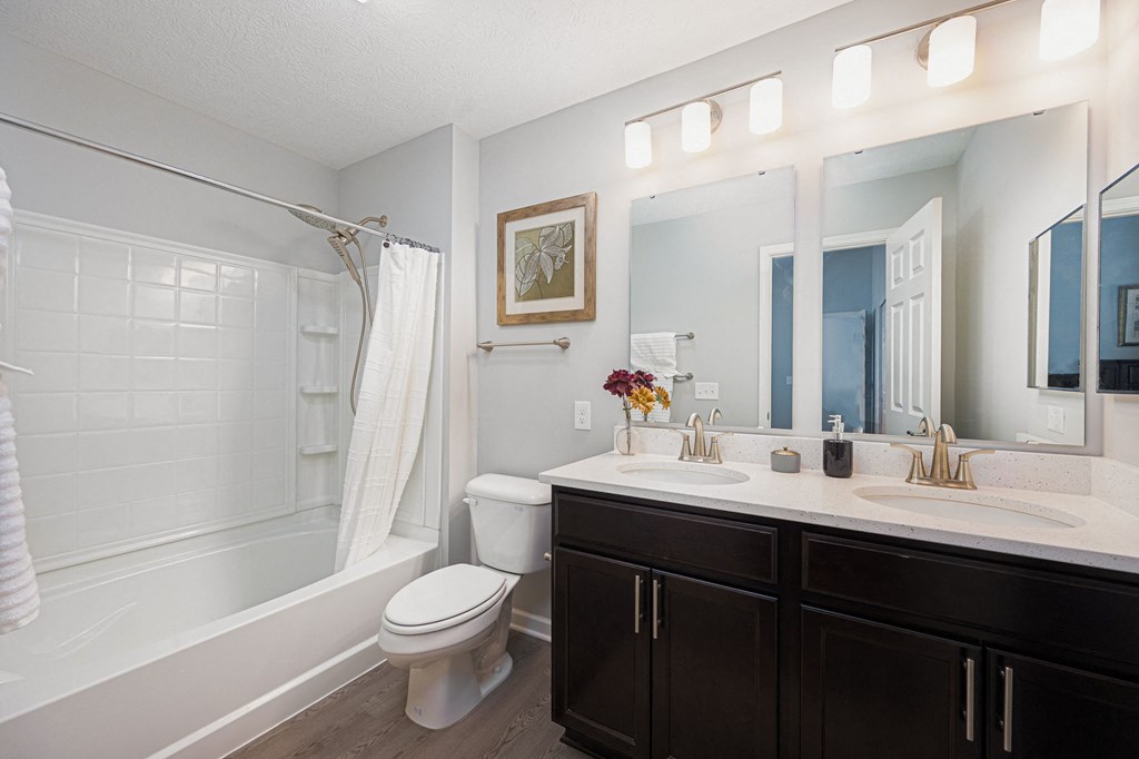 bathroom with sink toilet and shower