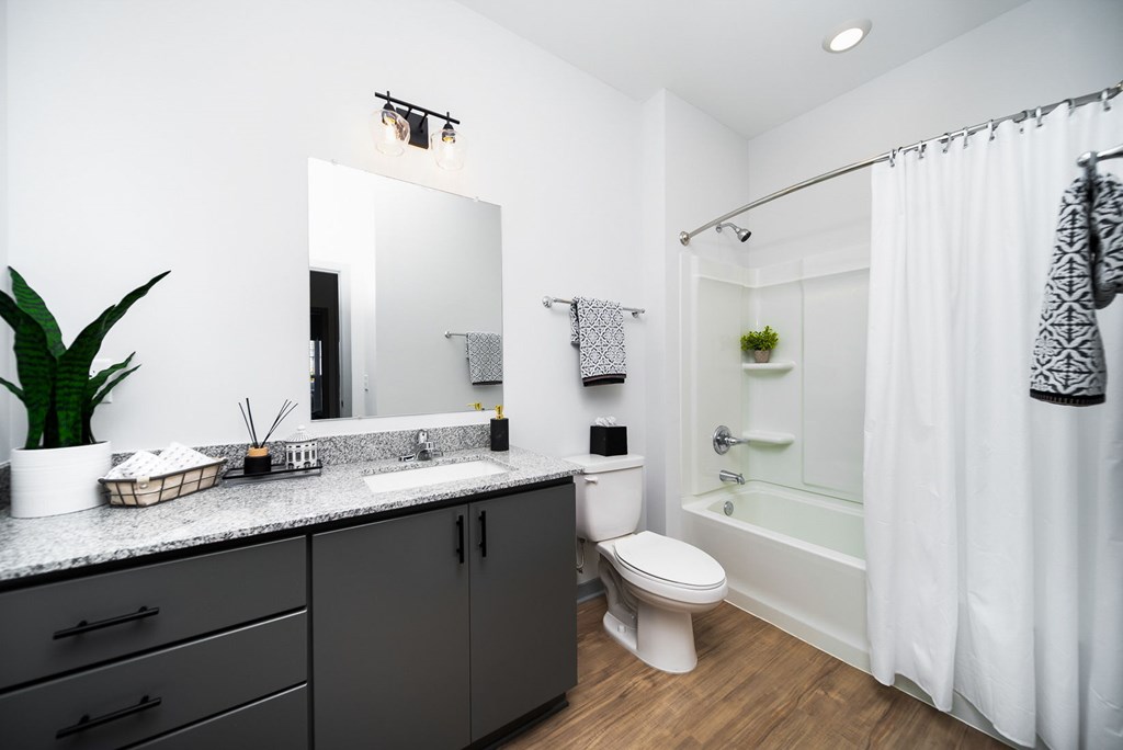 A bathroom with a white toilet and a white sink.
