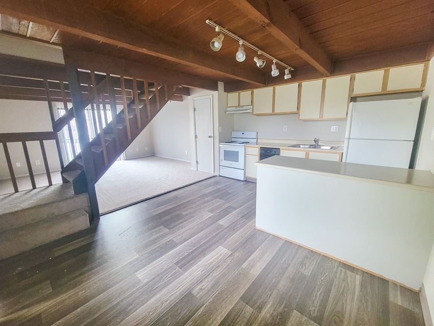 an open floor plan with a staircase leading up to the second floor - Photo Gallery
