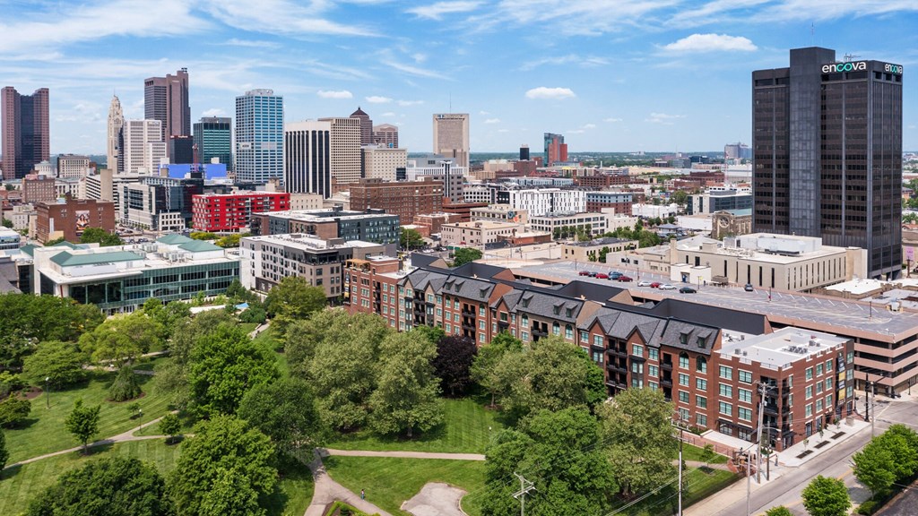 an aerial view of the city with buildings and trees