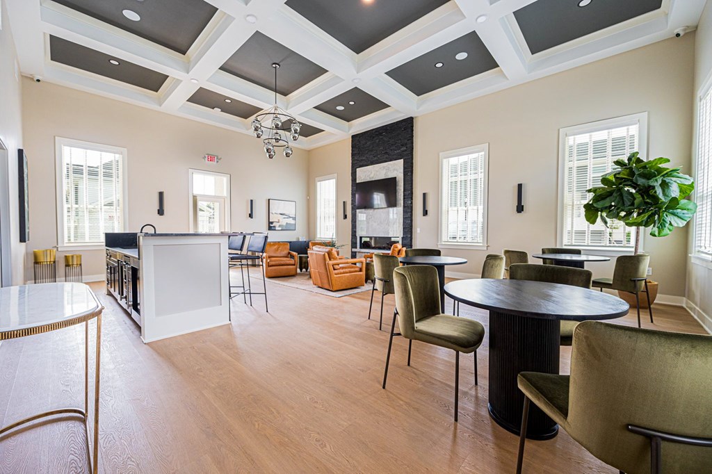 A large room with a white table and chairs.