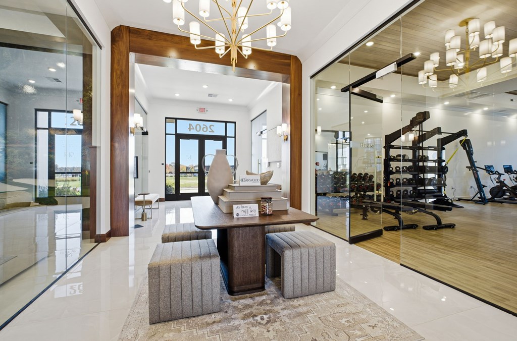 A modern living room with a wooden coffee table and a chandelier.
