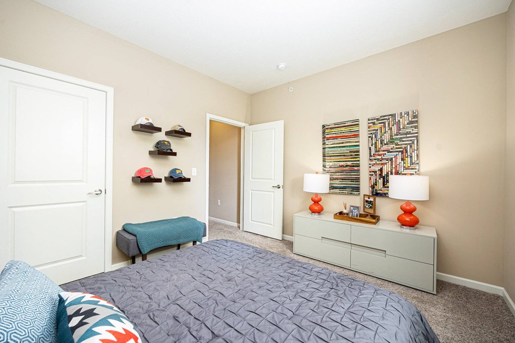 a bedroom with a bed and a closet