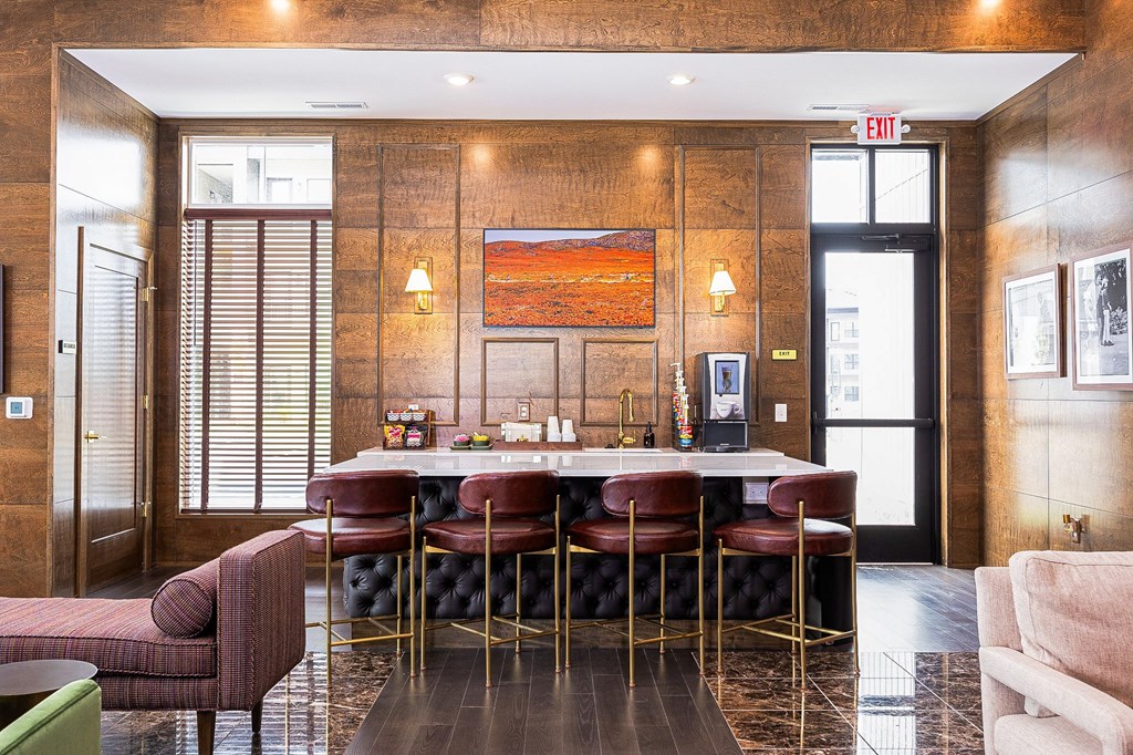 A brown wooden room with a table and chairs.
