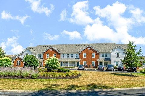 a large building with cars parked in front of it
