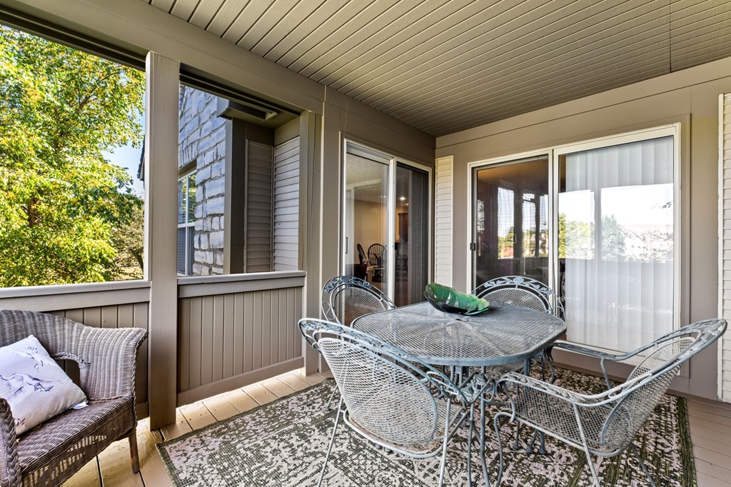 A patio with a table and chairs is shown.