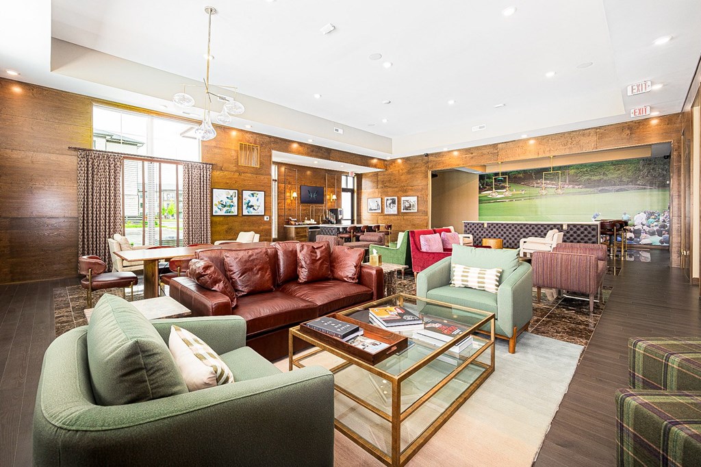 A living room with a green couch and a coffee table.