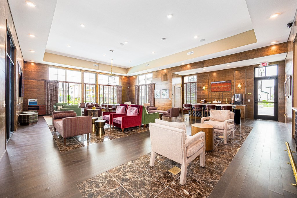 A large room with a lot of chairs and tables.