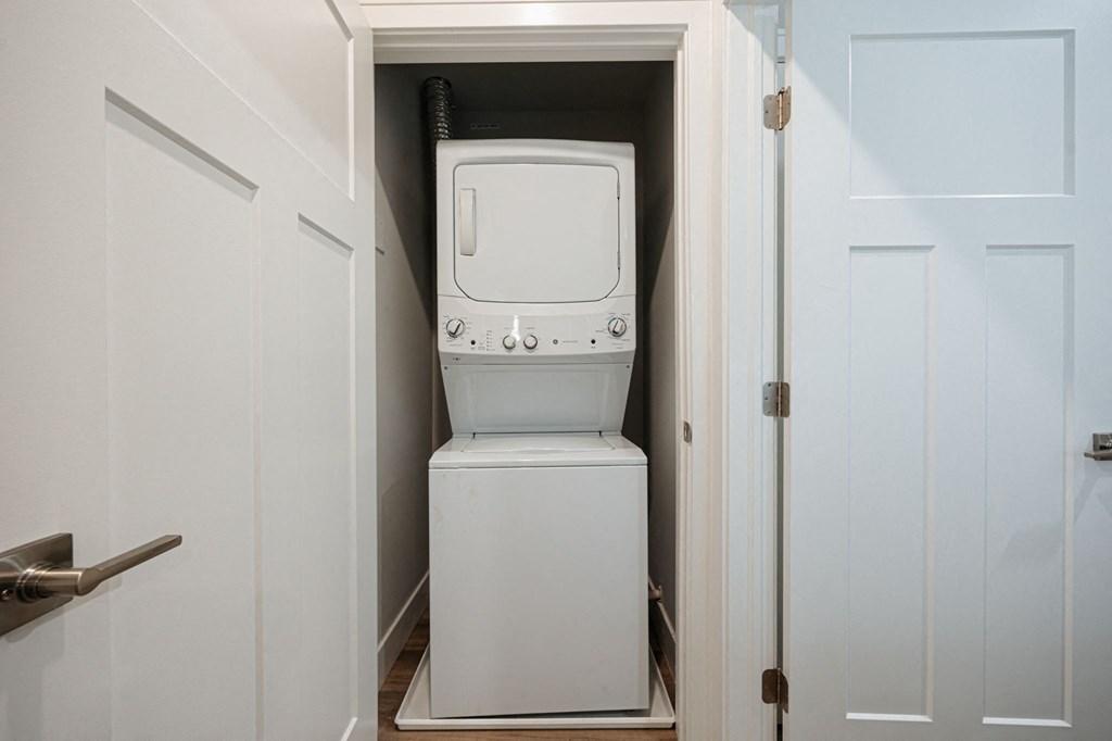 a small laundry room with a washer and dryer