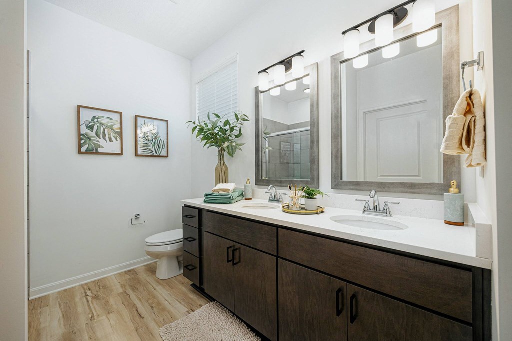 a bathroom with a large mirror and a sink