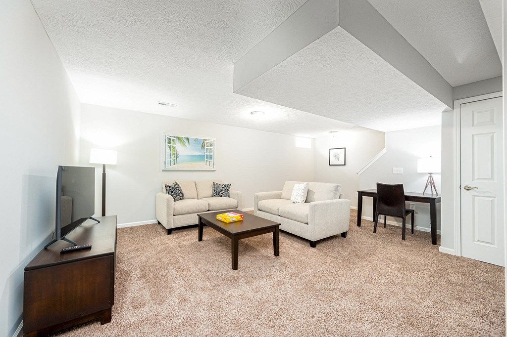 a living room with a couch and a table