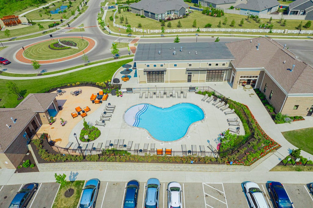 an aerial view of a large swimming pool in a parking lot