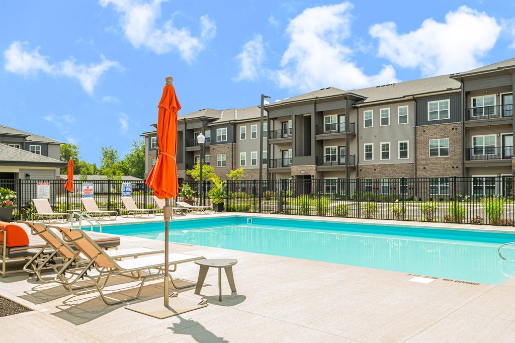 our apartments offer a swimming pool with chairs and umbrellas