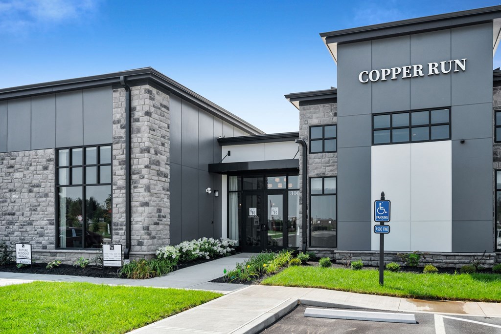 The front of a building with the name "COPPER RUN" on it.