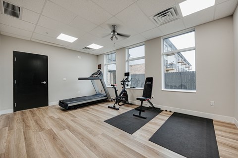 the heights gym with exercise equipment and windows