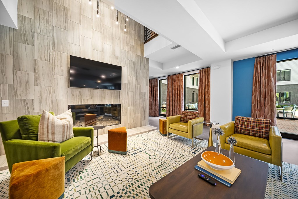 A living room with a fireplace and a television.