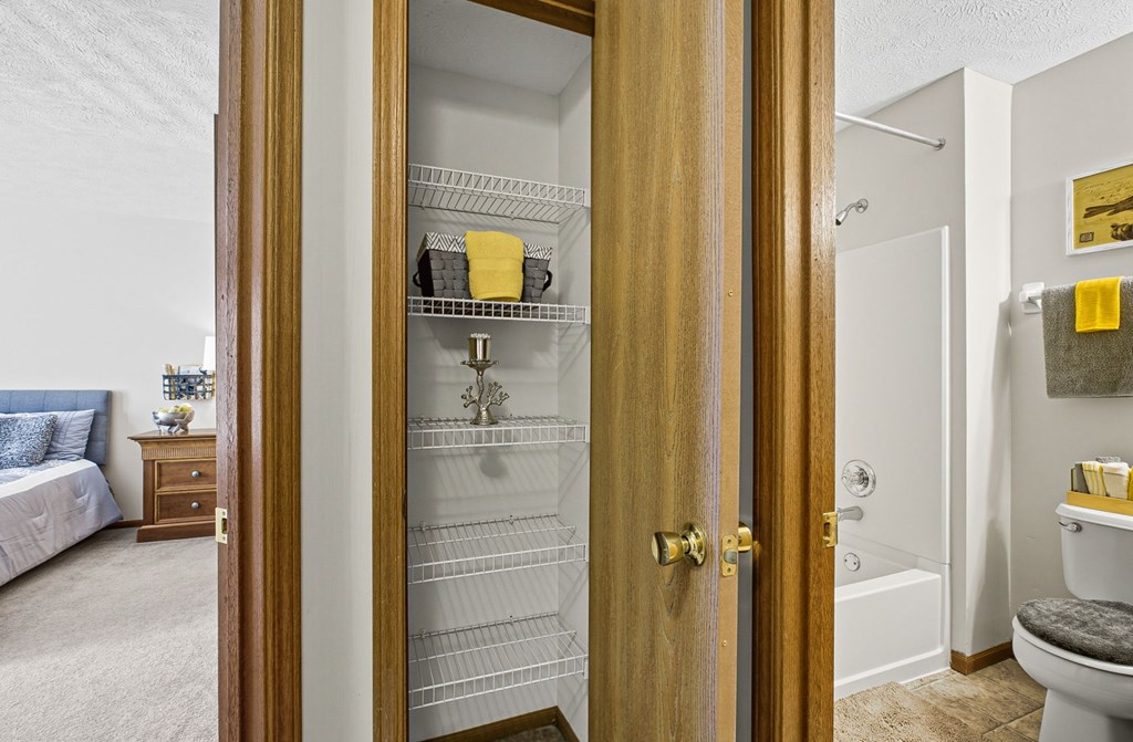 A white bathroom with a toilet and a sink.