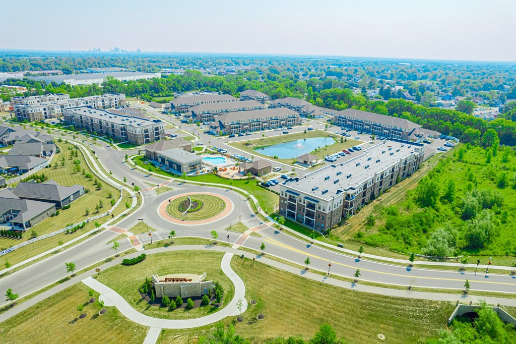 an aerial view of a city with roads and buildings