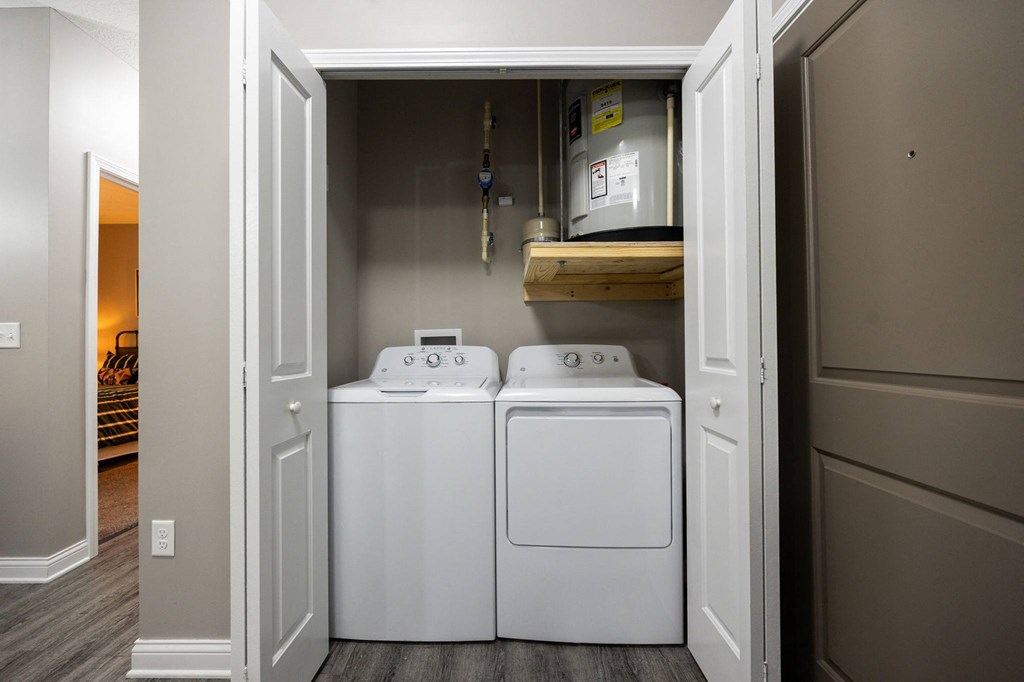 a laundry room with two washes and a dryer in it