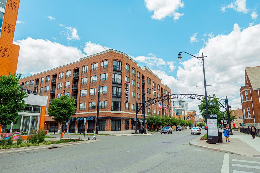 a large brick building on the corner of a city street