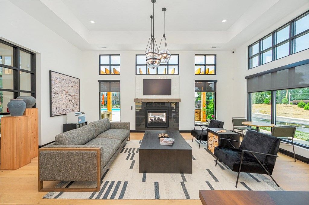 a living room with a couch and a coffee table and a fireplace