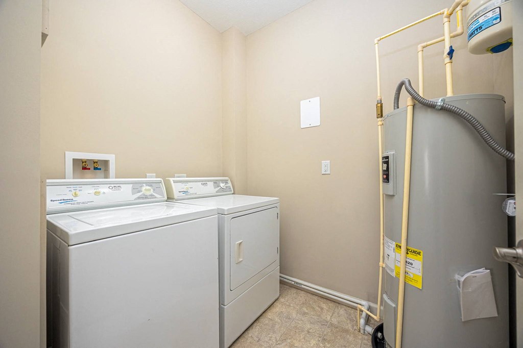 A laundry room with a washer and dryer.