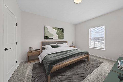 A bedroom with a large bed and a painting on the wall.