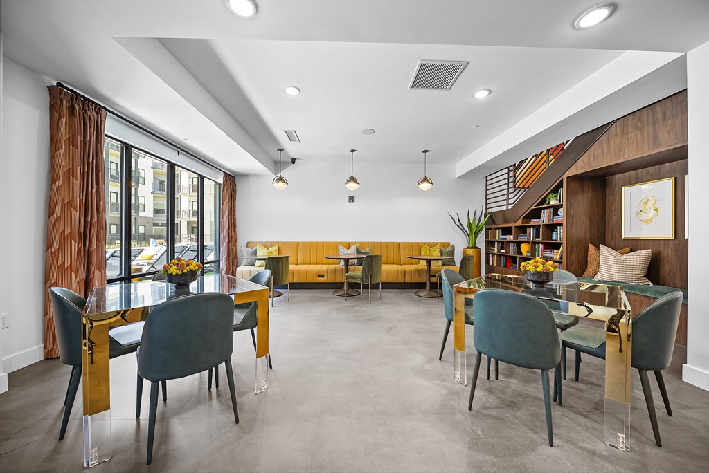 A dining room with a table set for six.