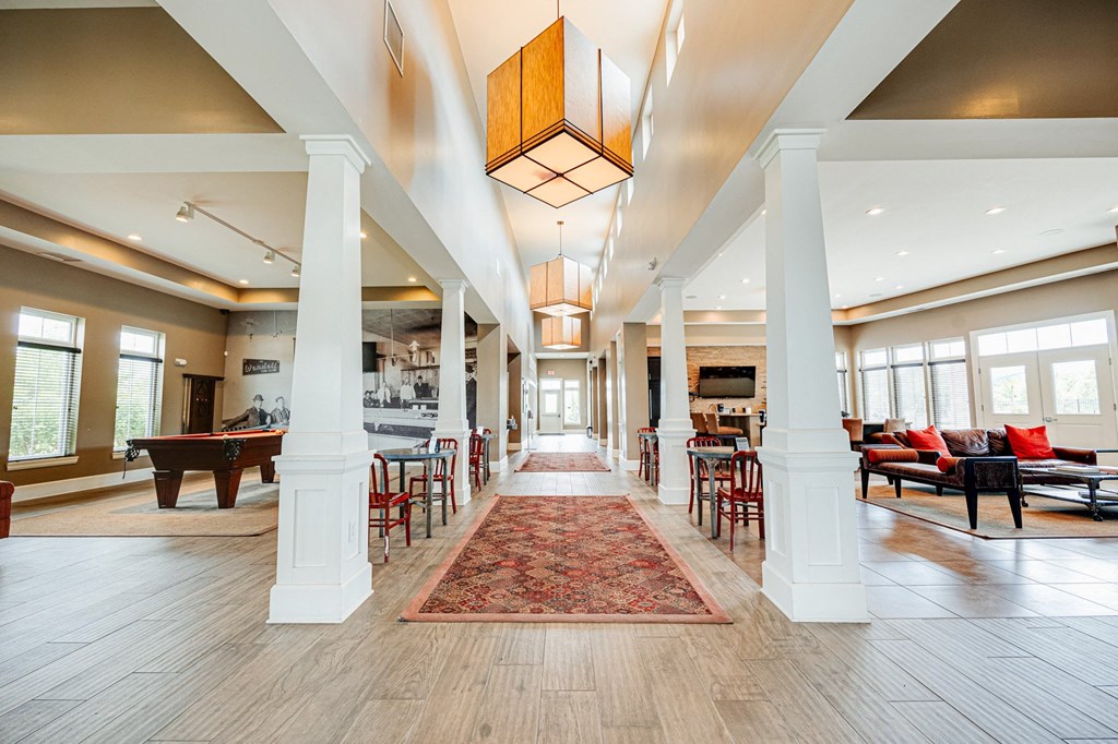 the preserve at cardinal courts spacious lobby with piano and tables