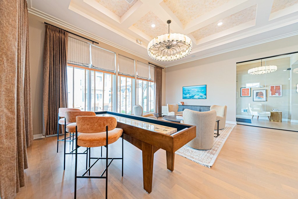 A living room with a brown chair and a wooden table.
