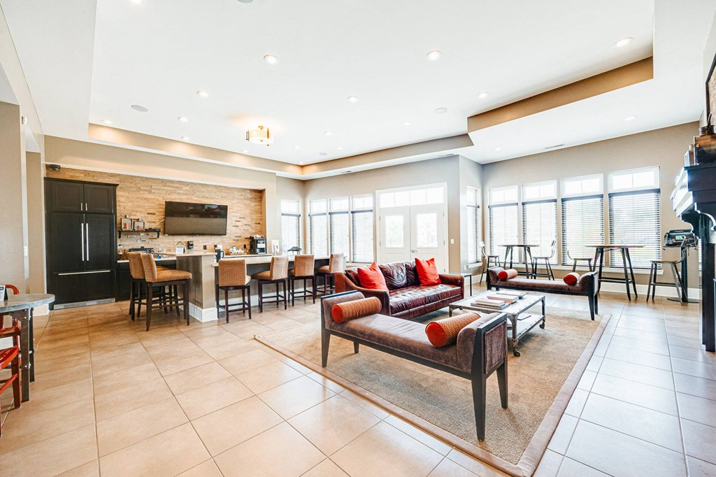 a living room with a couch and a table with chairs