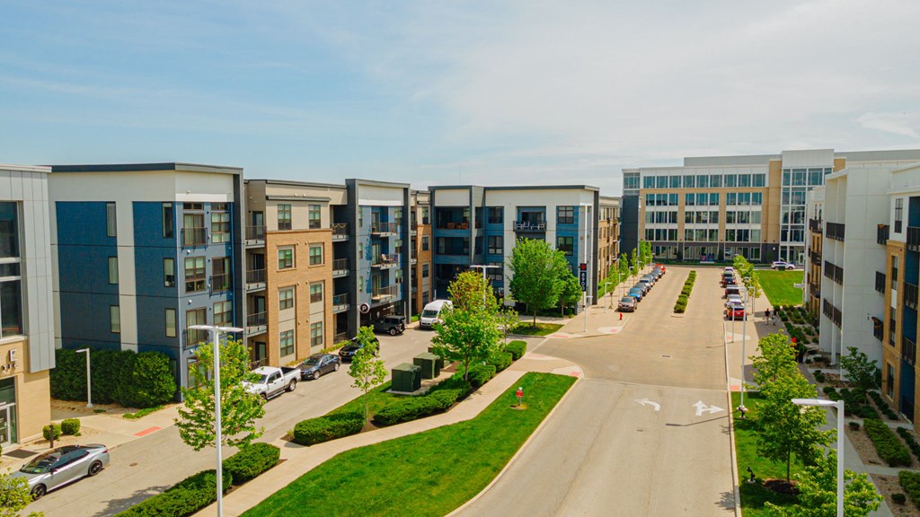 a row of apartment buildings on a city street