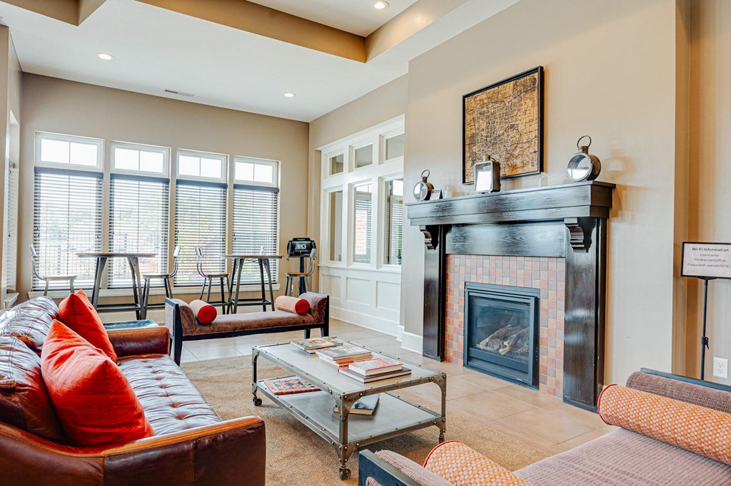 a living room with a fireplace and couches