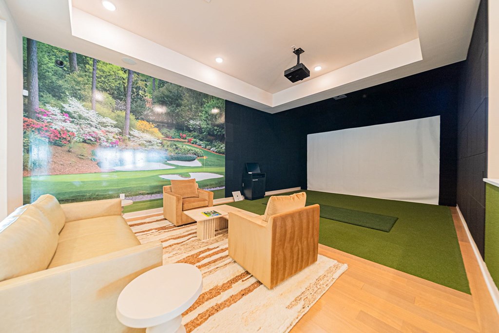 A living room with a large picture of a garden on the wall.