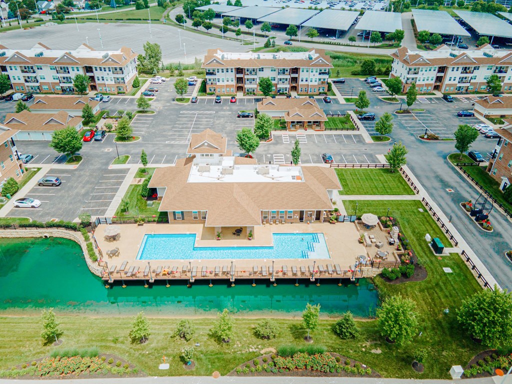 an aerial view of a large swimming pool in a parking lot