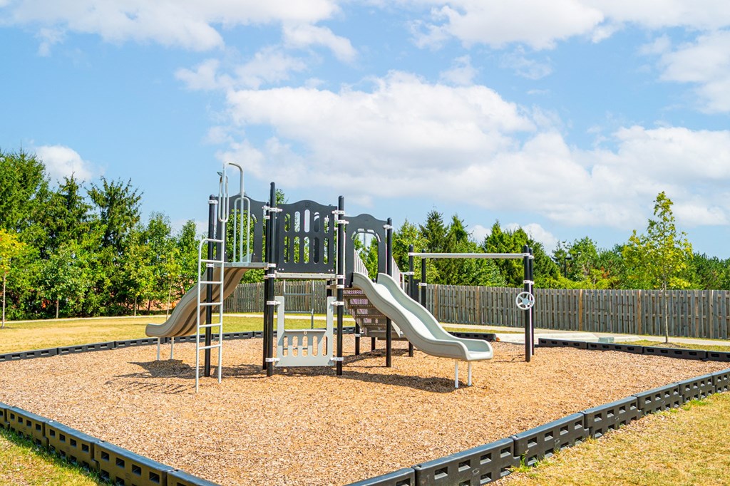 a playground with slides on a sunny day