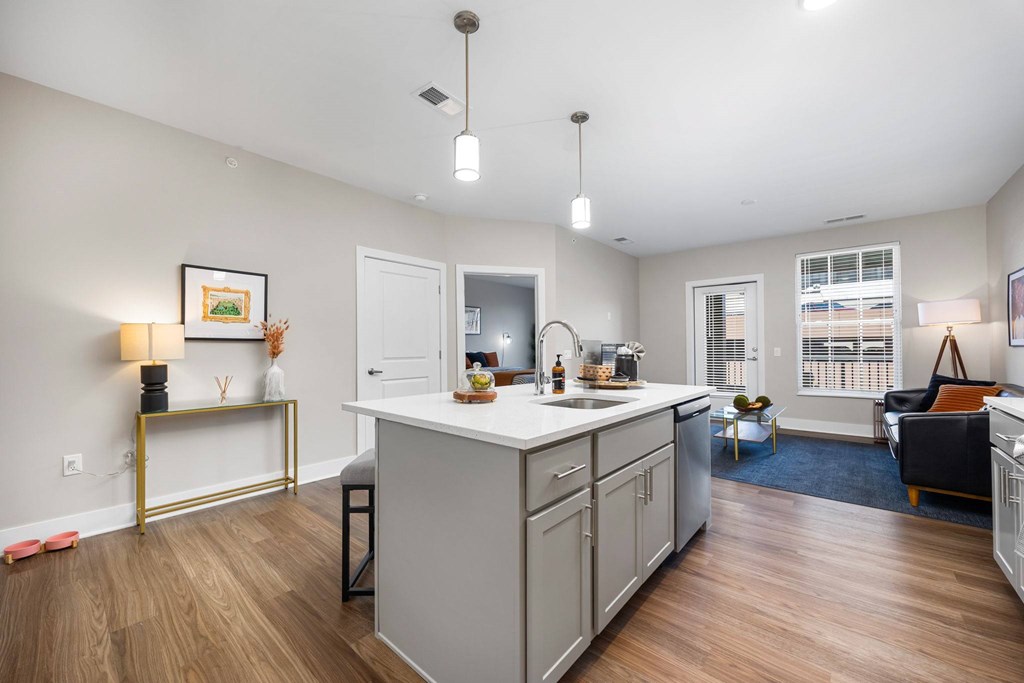 A kitchen with a white countertop and a white fridge.