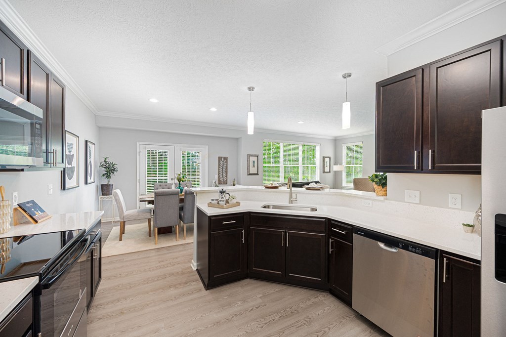 a kitchen and living room with a large counter top
