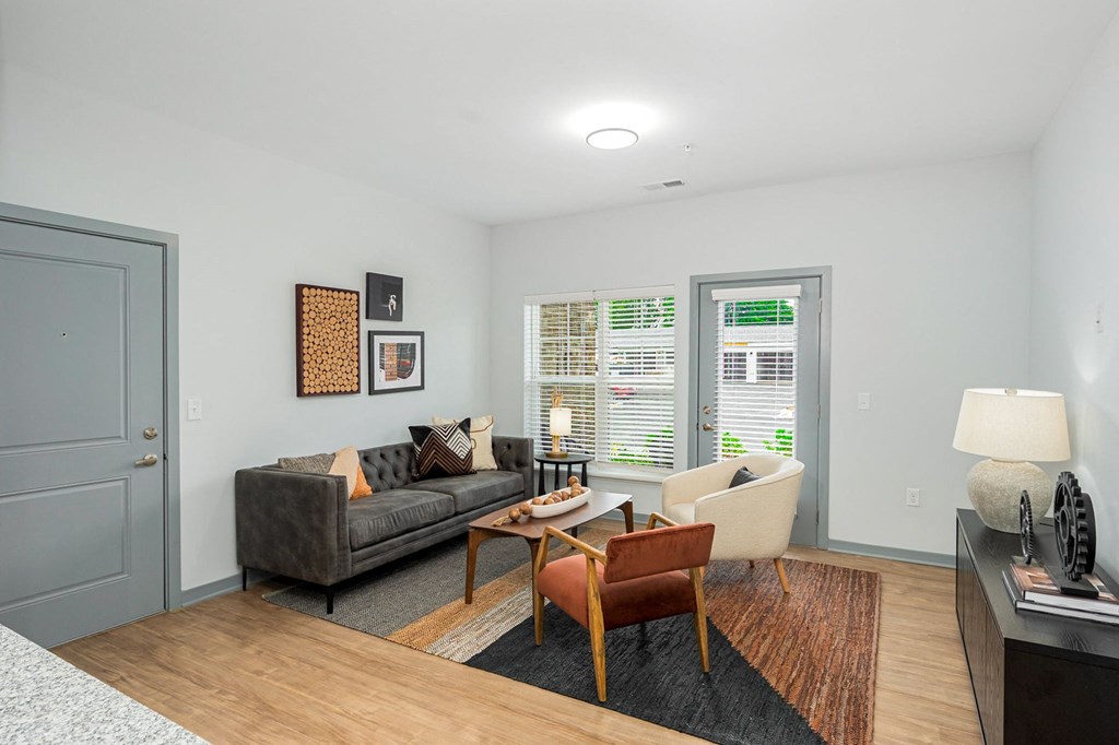 a living room with a couch and a chair and a table