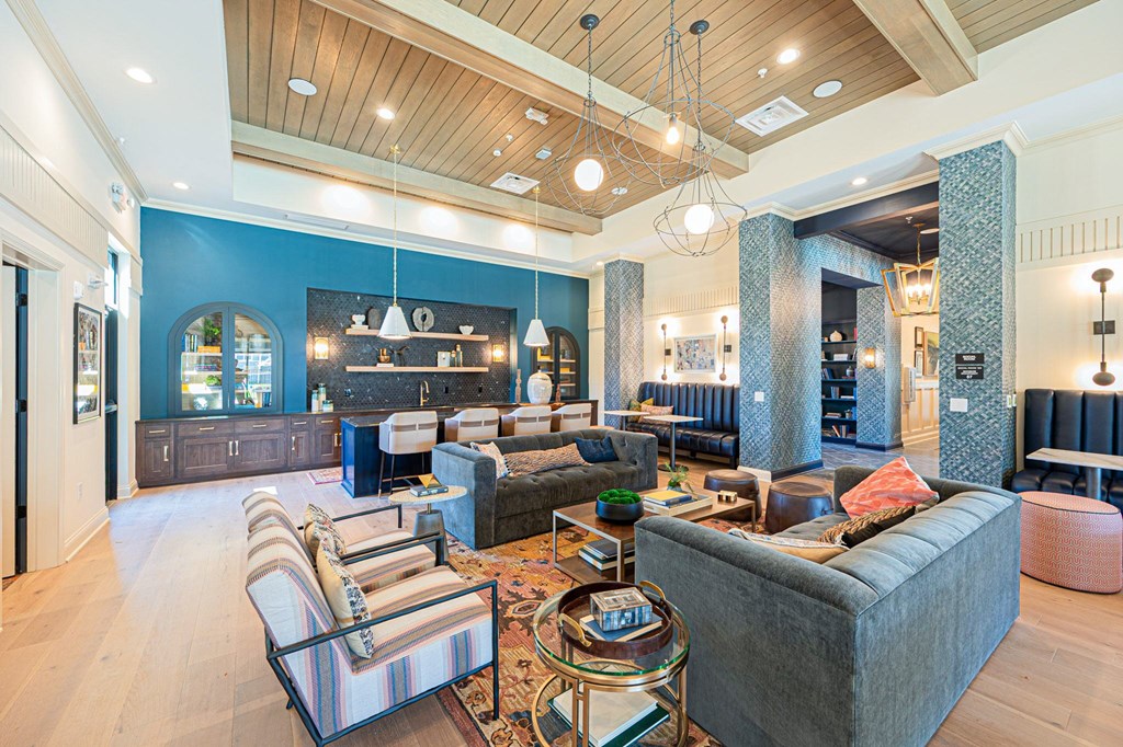 A living room with a grey couch and a coffee table.