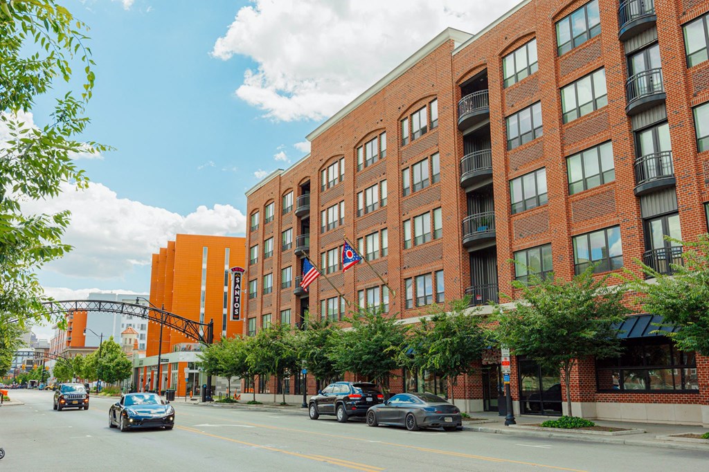 a large brick building on the corner of a city street
