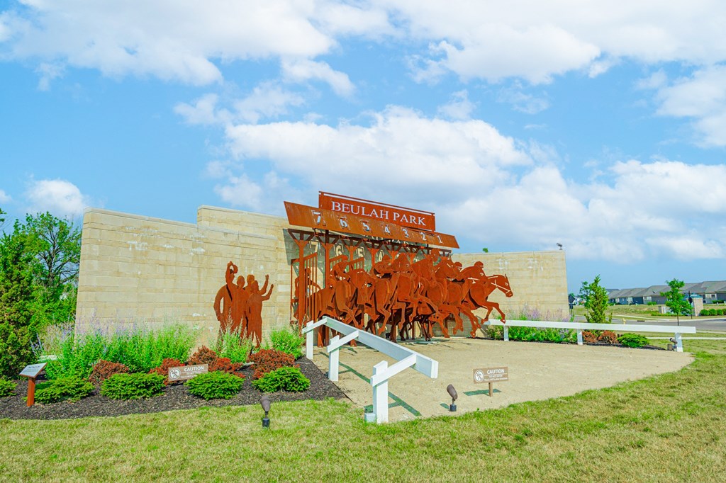 a mural of cattle on the side of a building