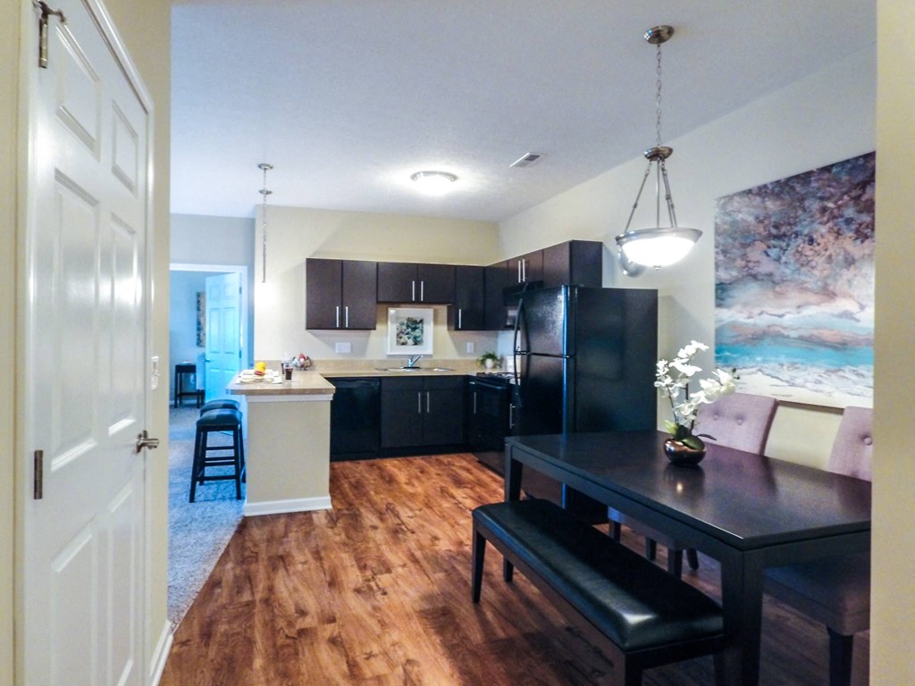 a view of the kitchen and dining room of a 560 square foot, 1 bedroom apartment at