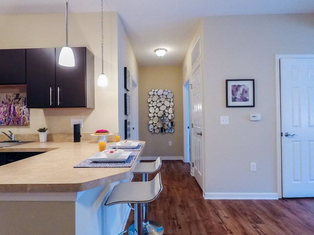 a kitchen with an island and stools