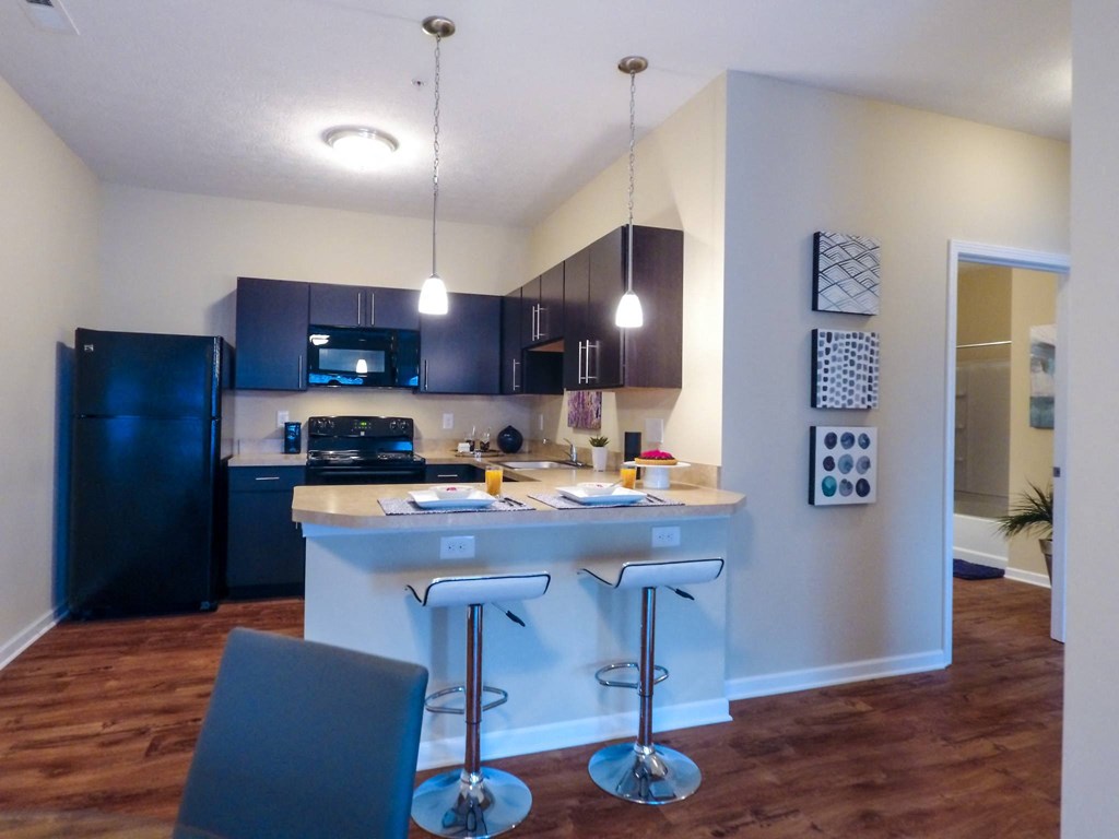 a kitchen and dining area in a 555 waverly unit
