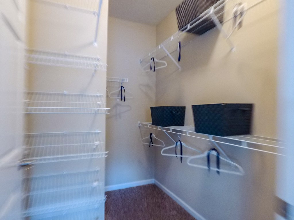 a walk in closet in a 555 waverly unit