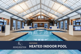 a heated indoor pool with a glass ceiling